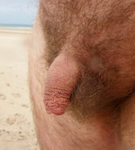Shriveled up penis on the beach