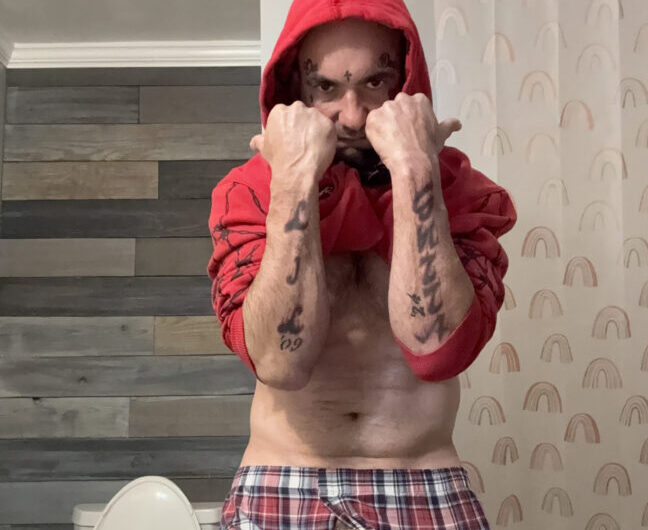 Guy shows off tattoos with his tiny boner poking out